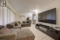 Living area with light wood-type flooring - 