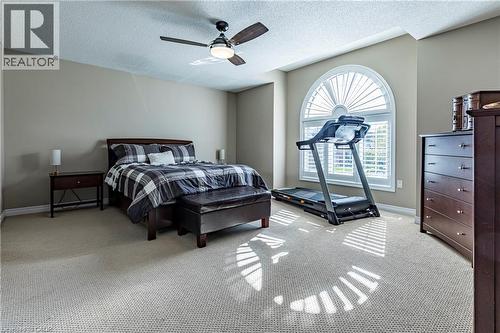 Bedroom featuring a textured ceiling, carpet, and ceiling fan - 28 Springbreeze Heights, Hamilton, ON - Indoor Photo Showing Bedroom