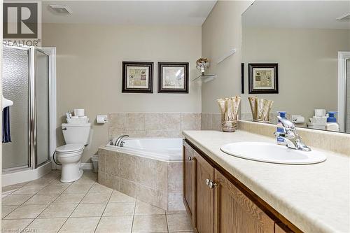 Full bath with a stall shower, vanity, and light tile patterned floors - 28 Springbreeze Heights, Hamilton, ON - Indoor Photo Showing Bathroom