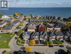 Aerial view of property and surrounding area featuring a large body of water - 