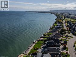 Aerial perspective of suburban area with a large body of water - 