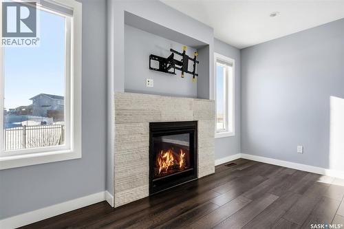 5669 Glide Crescent, Regina, SK - Indoor With Fireplace