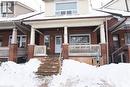 View of front facade featuring covered porch and brick siding - 82 Somerset Avenue, Hamilton, ON  - Outdoor With Deck Patio Veranda With Facade 
