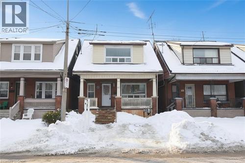 View of front of property with a porch and brick siding - 82 Somerset Avenue, Hamilton, ON - Outdoor With Deck Patio Veranda With Facade
