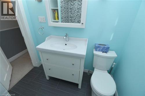 Bbathroom featuring vanity and toilet - 82 Somerset Avenue, Hamilton, ON - Indoor Photo Showing Bathroom