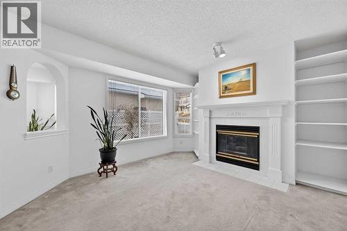 12 Sierra Morena Way Sw, Calgary, AB - Indoor With Fireplace
