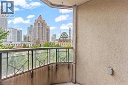 Balcony featuring a view of skyline - 