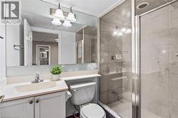 Bathroom featuring vanity and a stall shower - 