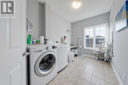 2959 Peacekeepers Way Sw, Calgary, AB - Indoor Photo Showing Laundry Room