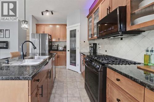 2959 Peacekeepers Way Sw, Calgary, AB - Indoor Photo Showing Kitchen With Stainless Steel Kitchen With Double Sink With Upgraded Kitchen