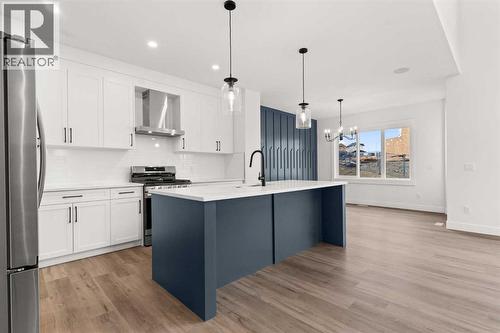 Picture is from a recent build by the builder with similar finishes and will be similar but not an exact match - 53 Heritage Park, Cochrane, AB - Indoor Photo Showing Kitchen With Upgraded Kitchen