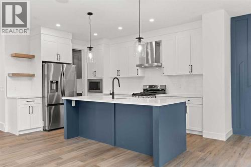 Picture is from a recent build by the builder with similar finishes and will be similar but not an exact match - 53 Heritage Park, Cochrane, AB - Indoor Photo Showing Kitchen With Upgraded Kitchen