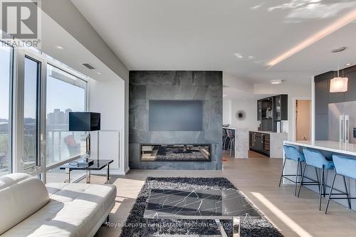 1002 - 90 Stadium Road, Toronto, ON - Indoor Photo Showing Living Room With Fireplace
