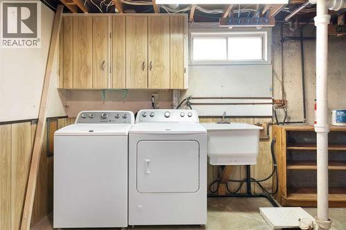 19 Carmangay Crescent Nw, Calgary, AB - Indoor Photo Showing Laundry Room