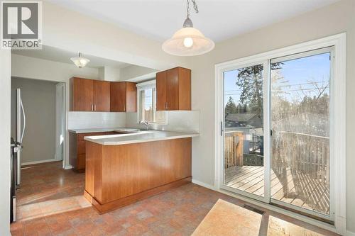 19 Carmangay Crescent Nw, Calgary, AB - Indoor Photo Showing Kitchen With Double Sink