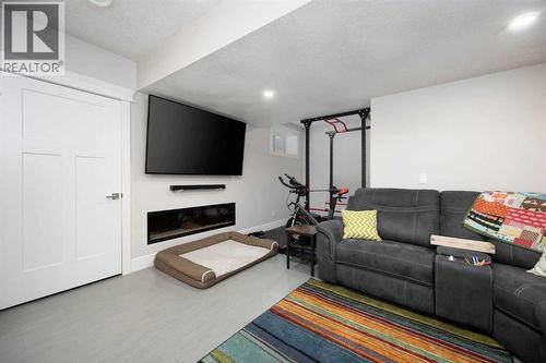 141 Pearson Drive, Fort Mcmurray, AB - Indoor Photo Showing Living Room With Fireplace