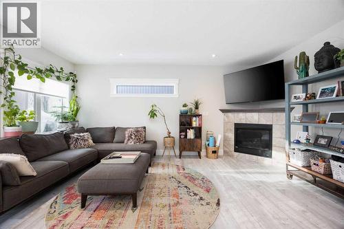 141 Pearson Drive, Fort Mcmurray, AB - Indoor Photo Showing Living Room With Fireplace