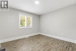 Spare room with wood finished floors - 