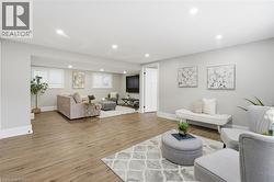 Living area featuring recessed lighting and light wood finished floors - 