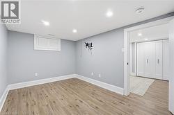 Finished basement featuring light wood-type flooring and recessed lighting - 