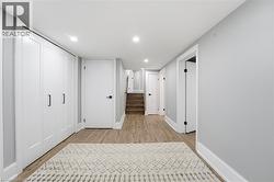 Hall featuring stairway, recessed lighting, and light wood-type flooring - 