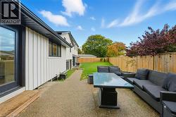 Fenced backyard with an outdoor hangout area and a patio area - 