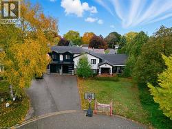 View from above of property with a tree filled landscape - 