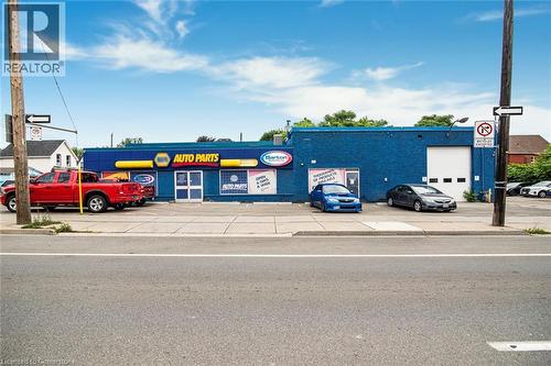 View of commercial property with uncovered parking - 361 Cannon Street E, Hamilton, ON 