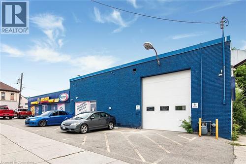 View of commercial location featuring uncovered parking - 361 Cannon Street E, Hamilton, ON 