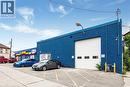 View of commercial location featuring uncovered parking - 361 Cannon Street E, Hamilton, ON 