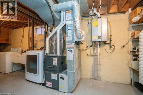 Water heater and furnace owned. - 313 Barton Street W, Hamilton, ON - Indoor Photo Showing Laundry Room