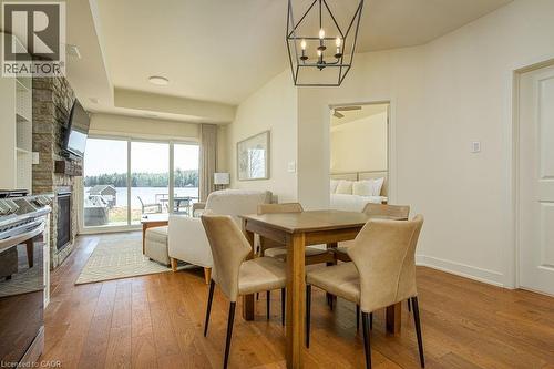 1869 Muskoka 118 Road W Unit# Btv-105, Bracebridge, ON - Indoor Photo Showing Dining Room With Fireplace