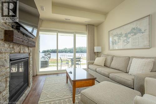 1869 Muskoka 118 Road W Unit# Btv-105, Bracebridge, ON - Indoor Photo Showing Living Room With Fireplace