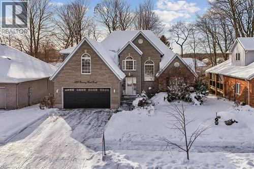 View of front facade featuring brick siding and an attached garage - 629 Burning Bush Road, Waterloo, ON - Outdoor With Facade