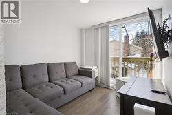 Living area featuring wood finished floors - 