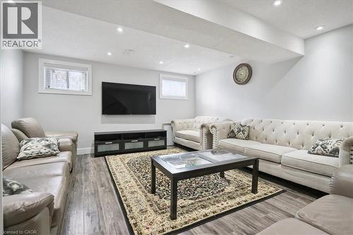 Living room with wood finished floors and recessed lighting - 629 Burning Bush Road, Waterloo, ON - Indoor Photo Showing Living Room