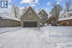 View of front of house featuring an attached garage - 
