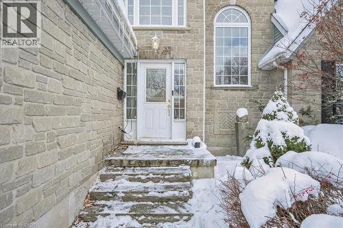 Snow covered property entrance with stone siding - 629 Burning Bush Road, Waterloo, ON - Outdoor
