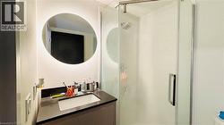 Full bath featuring vanity and a shower stall - 