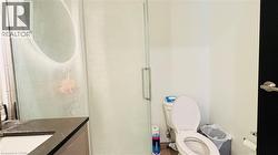 Bathroom with a stall shower and vanity - 