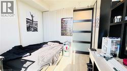 Bedroom with light wood-style flooring - 