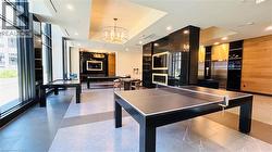 Playroom with recessed lighting and a chandelier - 