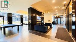 Lobby with a wall of windows and recessed lighting - 