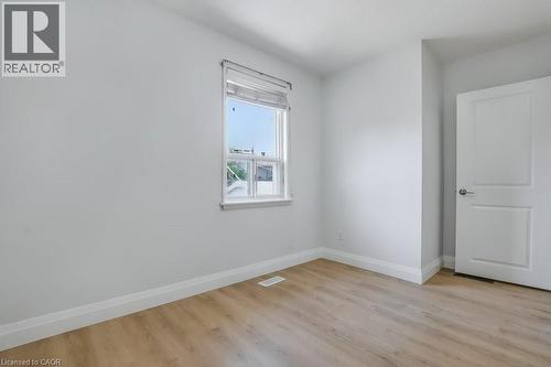 Unfurnished room featuring baseboards and light wood-style floors - 111 Castlefield Drive, Hamilton, ON - Indoor Photo Showing Other Room