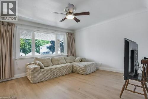 Living room with wood finished floors and a ceiling fan - 111 Castlefield Drive, Hamilton, ON - Indoor