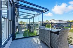 Deck featuring a residential view and a grill - 