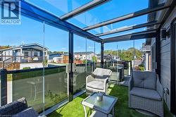 Sunroom / solarium with a residential view - 