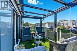 Sunroom featuring a residential view - 