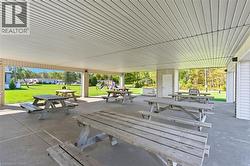 View of home's community with a yard, a patio area, and outdoor dining space - 