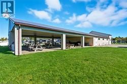 Surrounding community with a patio and a yard - 